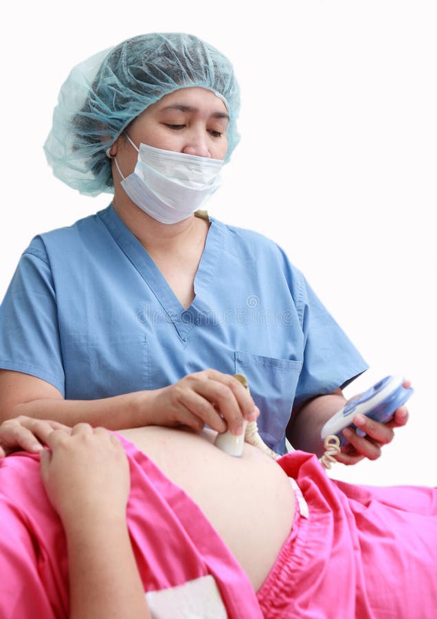 Healthcare worker assisting a pregnant woman during a pregnancy-related emergency